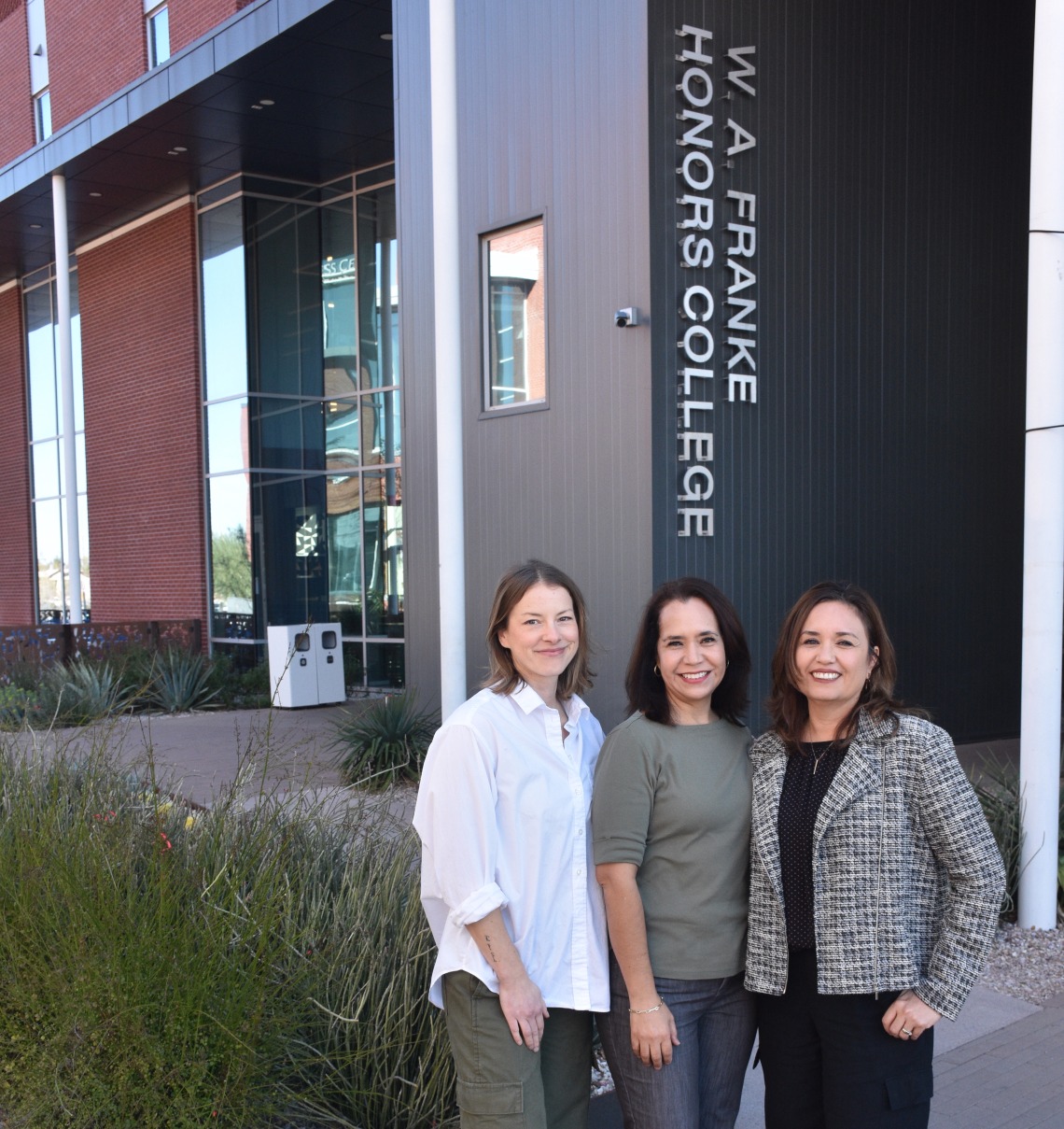 image of three women standing in front of the Honors Village