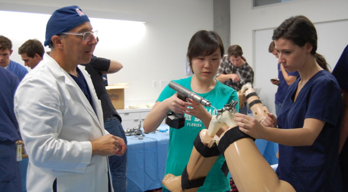 Students working on prosthetic knee 