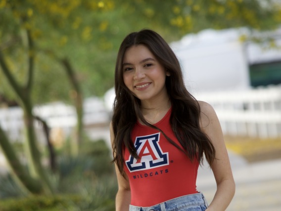 student wearing red University of arizona shirt